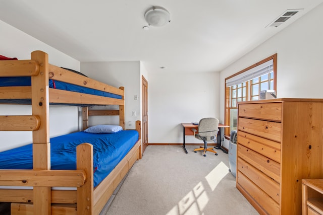 bedroom featuring light carpet