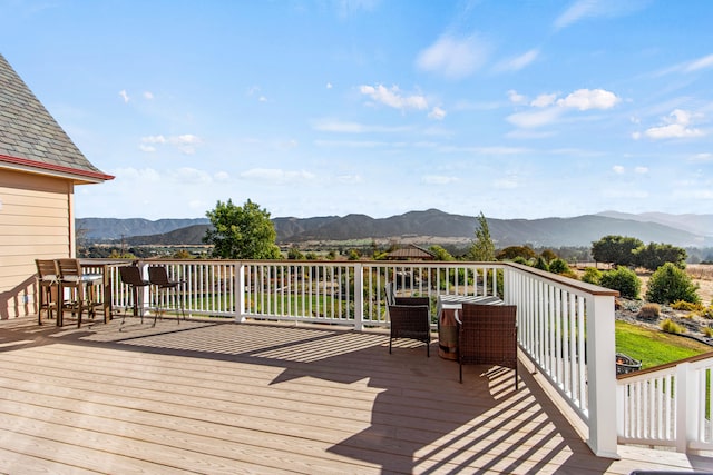 wooden deck featuring a mountain view