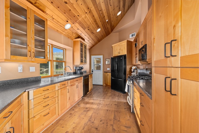 kitchen featuring wood ceiling, light hardwood / wood-style flooring, black appliances, sink, and vaulted ceiling