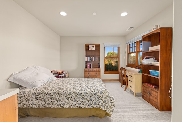 bedroom with light colored carpet