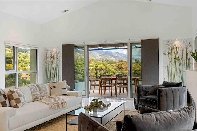 carpeted living room with a mountain view