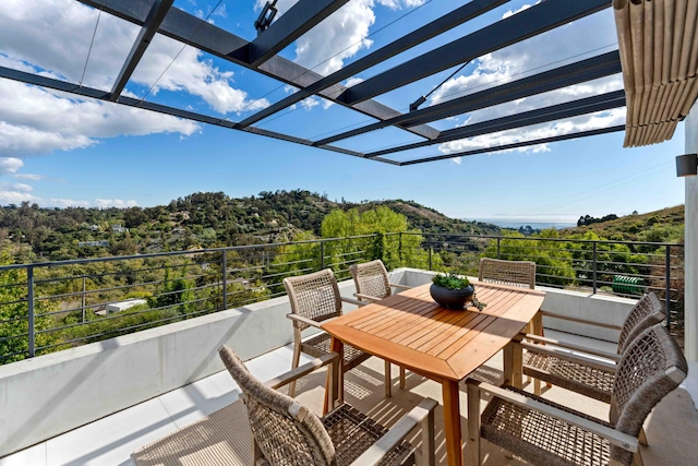 balcony featuring a pergola