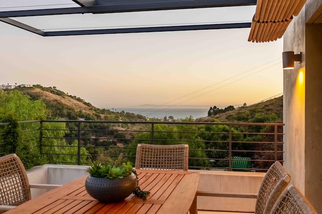 view of balcony at dusk