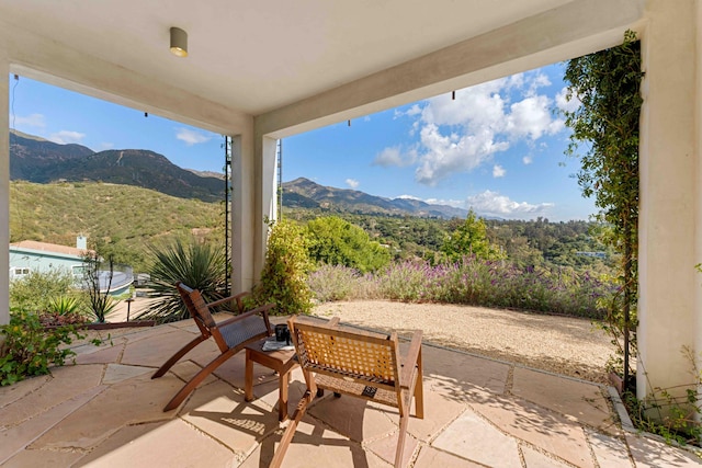 view of patio / terrace featuring a mountain view