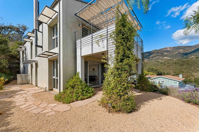 view of home's exterior with a mountain view