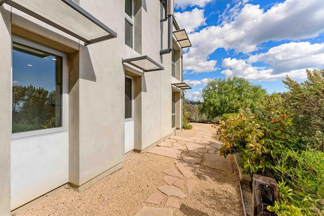 view of side of home featuring a patio area