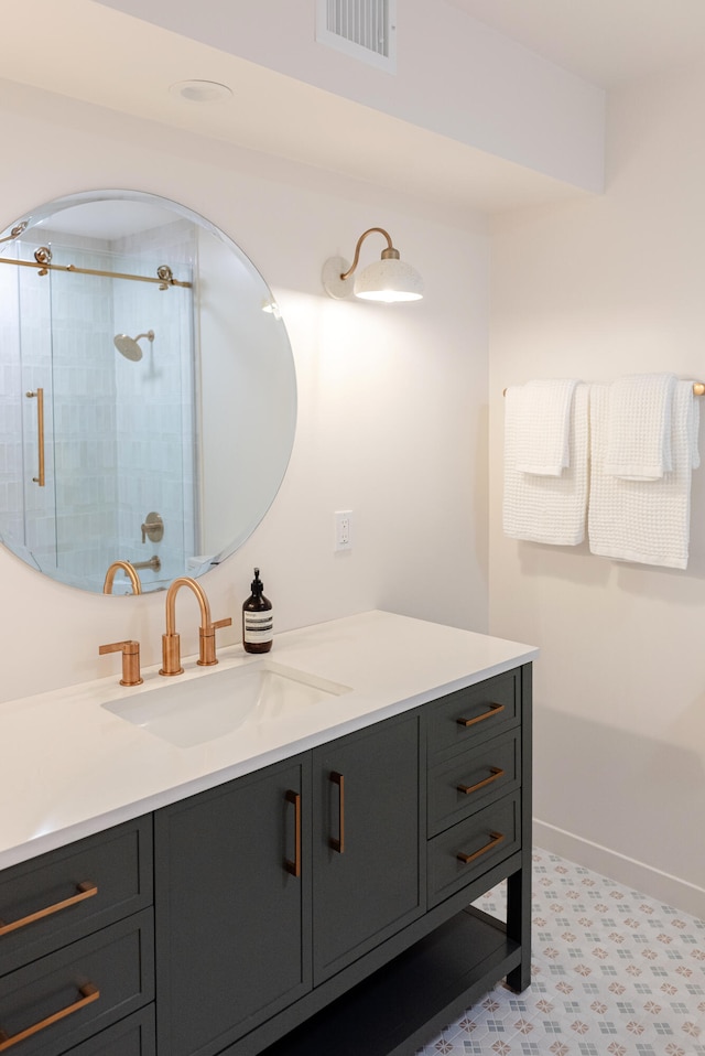 bathroom featuring vanity and an enclosed shower