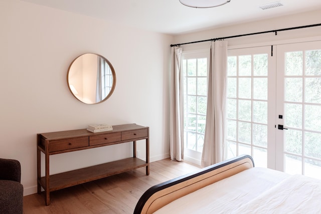 bedroom with wood-type flooring