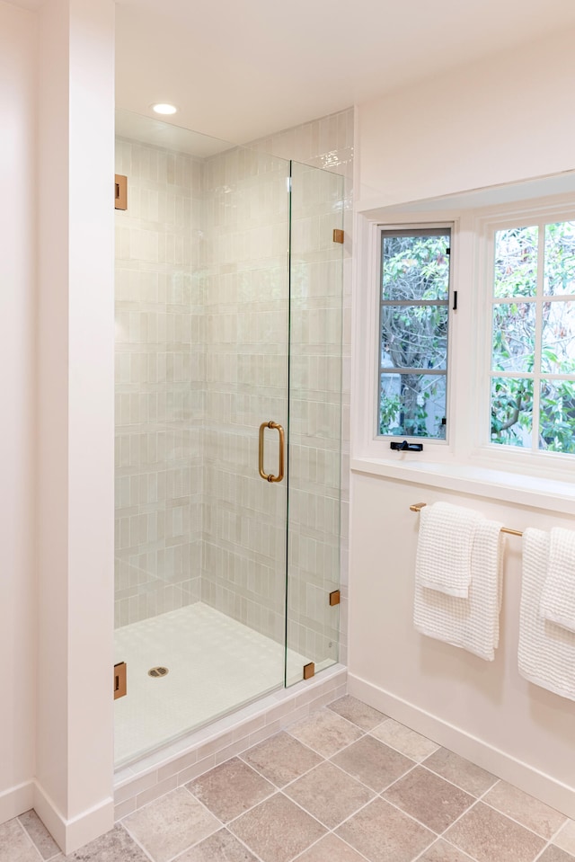 bathroom featuring an enclosed shower