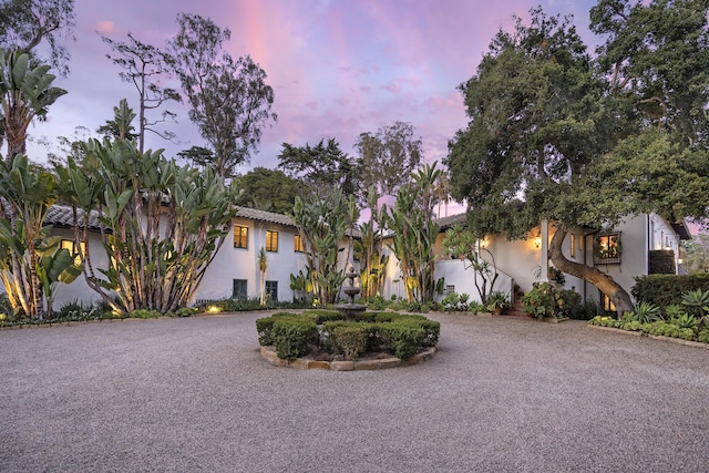 2925 Sycamore Canyon Rd, Montecito, CA 93108 - view of front of house with stucco siding and curved driveway