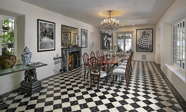 2925 Sycamore Canyon Rd, Montecito, CA 93108 - dining space with a premium fireplace, a chandelier, and visible vents