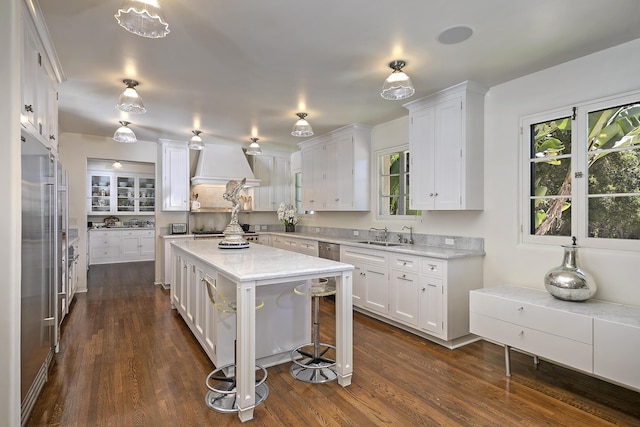 2925 Sycamore Canyon Rd, Montecito, CA 93108 - kitchen featuring white cabinetry, dark wood-style flooring, appliances with stainless steel finishes, and premium range hood