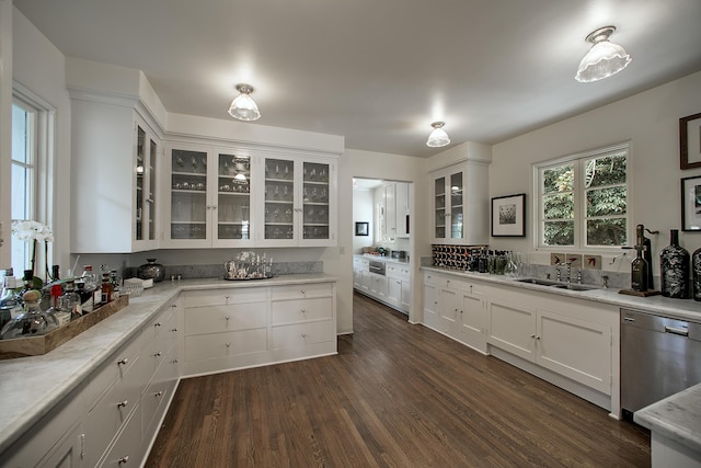 2925 Sycamore Canyon Rd, Montecito, CA 93108 - kitchen with white cabinetry, dark wood finished floors, a sink, and stainless steel dishwasher