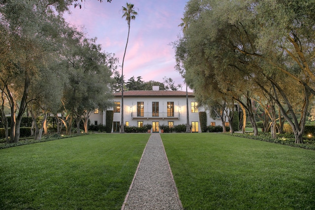 2925 Sycamore Canyon Rd, Montecito, CA 93108 - view of front of property featuring a chimney, stucco siding, a front yard, and a tiled roof