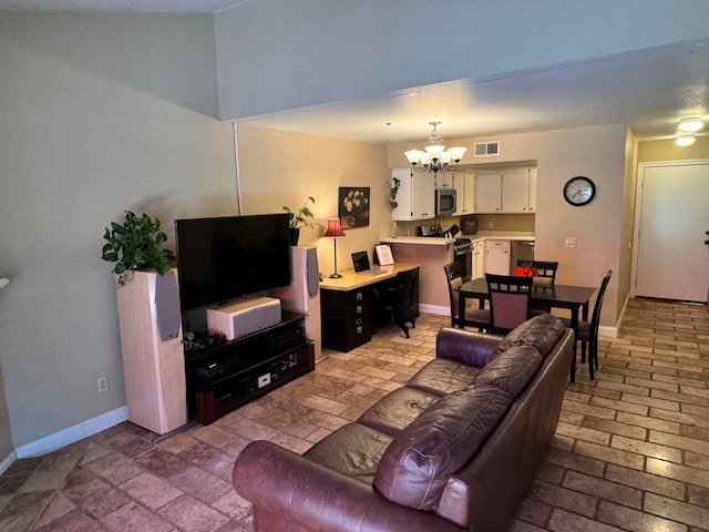 living room with a notable chandelier