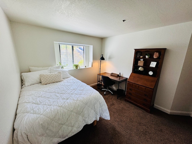 carpeted bedroom featuring a textured ceiling