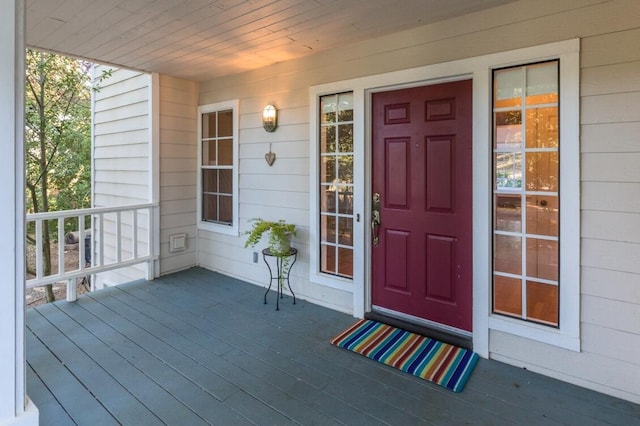 property entrance with covered porch