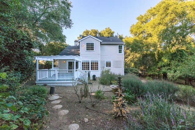 back of house featuring a pergola and a deck