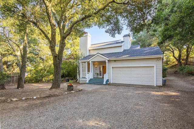 view of front of house featuring a garage and covered porch