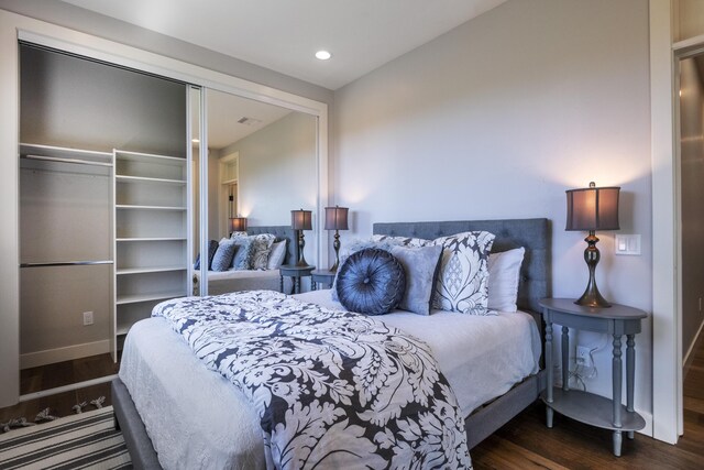 bedroom featuring a closet, wood finished floors, visible vents, and recessed lighting