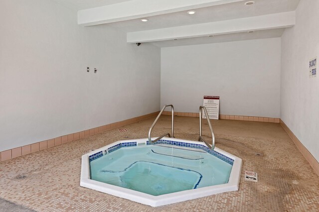 view of pool featuring an indoor hot tub