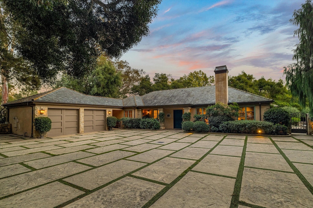 ranch-style house featuring a garage