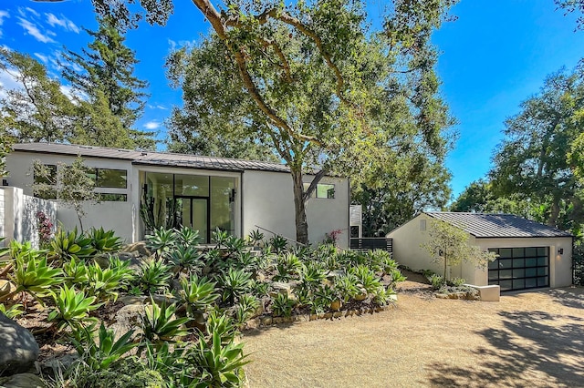 view of property exterior featuring a garage