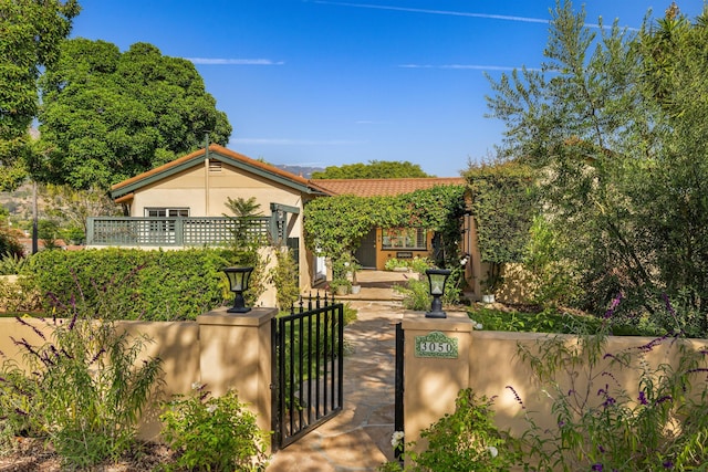 3050 Serena Rd, Santa Barbara, CA 93105 - bungalow featuring a gate, a fenced front yard, and stucco siding