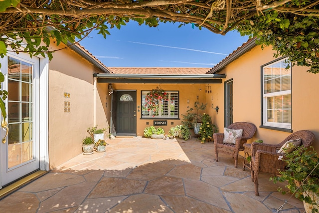 3050 Serena Rd, Santa Barbara, CA 93105 - entrance to property with a tiled roof, a patio, and stucco siding