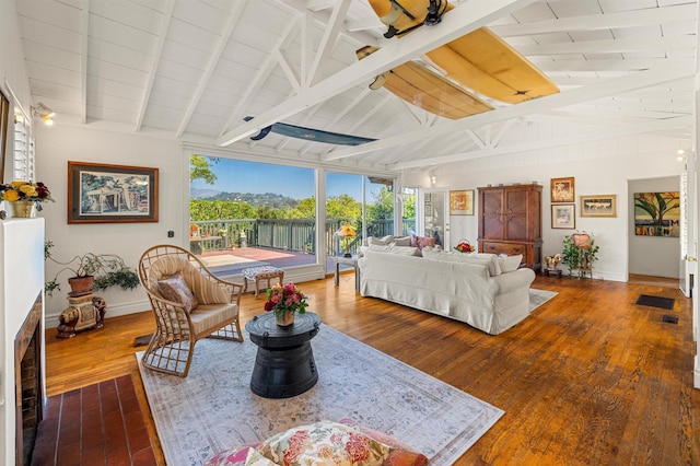 3050 Serena Rd, Santa Barbara, CA 93105 - living area with vaulted ceiling with beams, baseboards, wood ceiling, and hardwood / wood-style floors