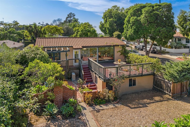 3050 Serena Rd, Santa Barbara, CA 93105 - rear view of house featuring fence, a deck, stucco siding, stairs, and a tiled roof