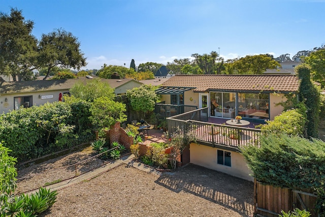 3050 Serena Rd, Santa Barbara, CA 93105 - back of property featuring stucco siding, fence, a tiled roof, and a deck