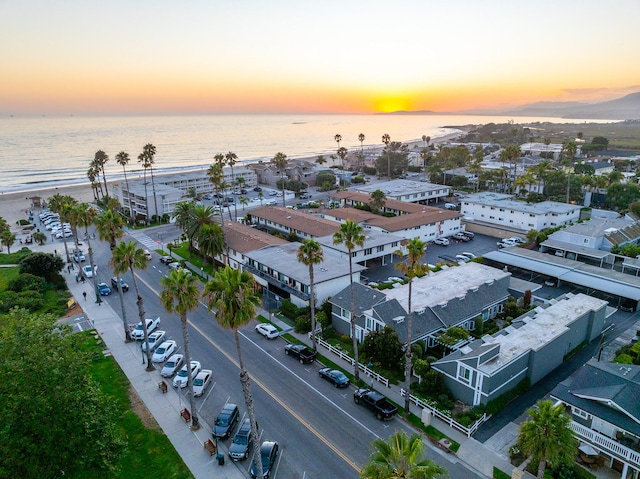 aerial view at dusk with a water view