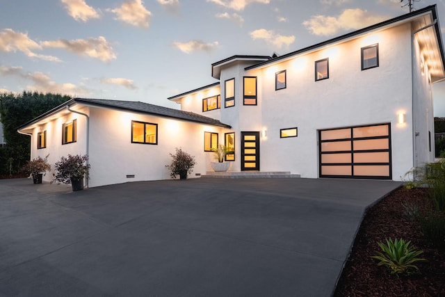 modern home featuring a garage