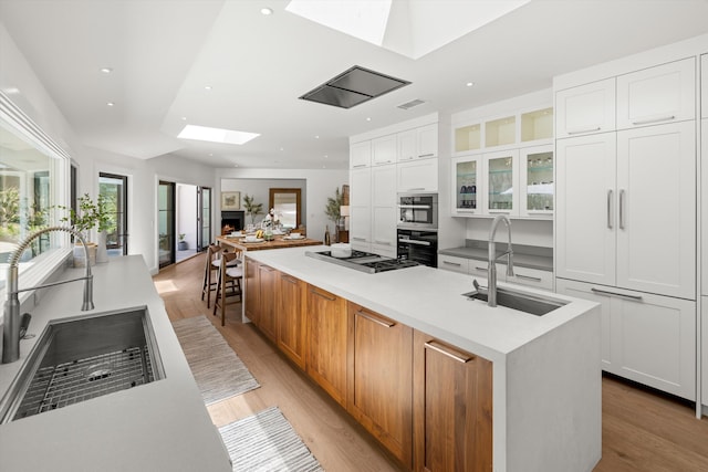 kitchen featuring white cabinetry and a large island