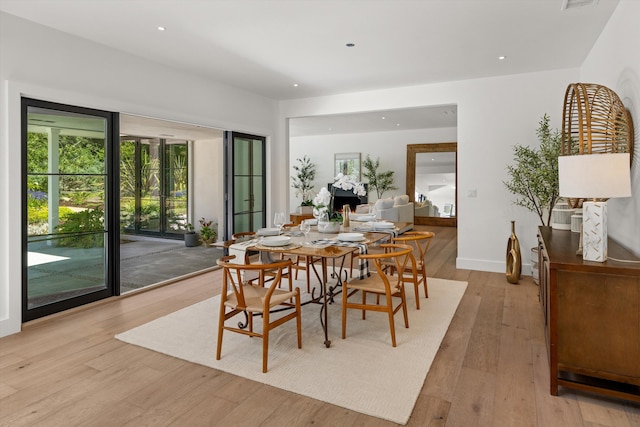 dining space featuring light hardwood / wood-style floors