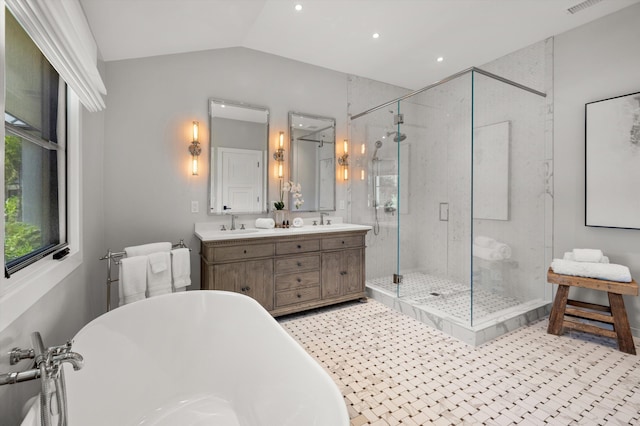 bathroom featuring lofted ceiling, vanity, and separate shower and tub