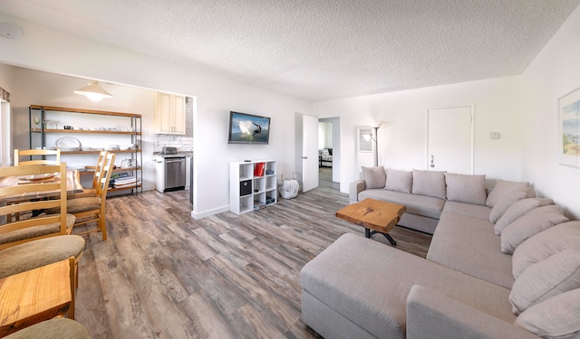 living room featuring a textured ceiling and hardwood / wood-style flooring