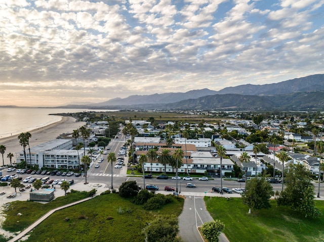 drone / aerial view with a water and mountain view