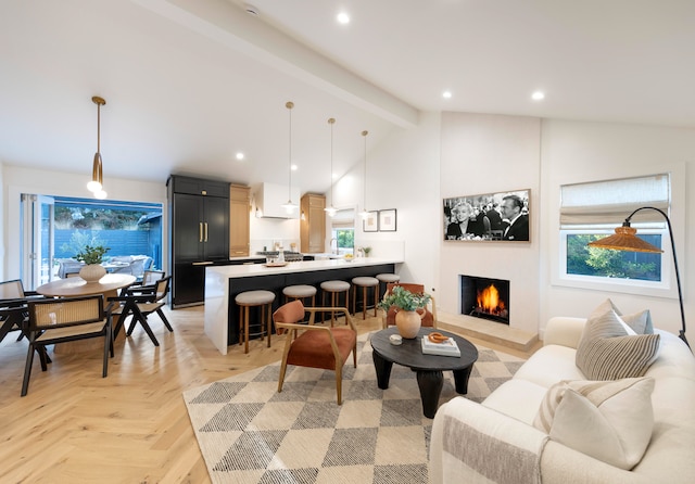 living room with light parquet floors and vaulted ceiling with beams