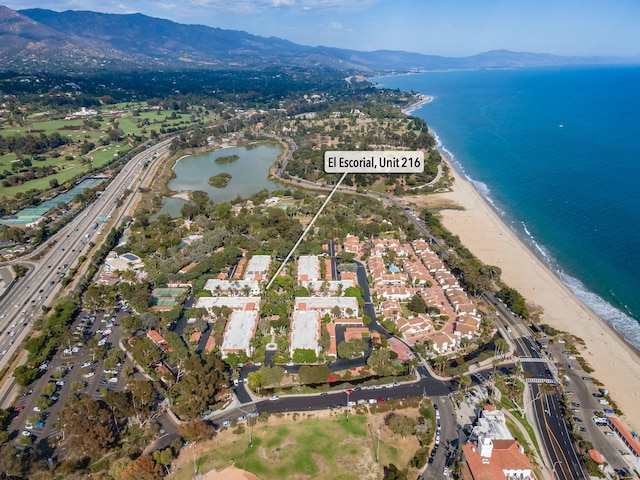 aerial view featuring a beach view and a water and mountain view