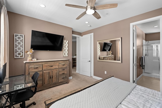 carpeted bedroom with ceiling fan and ensuite bathroom