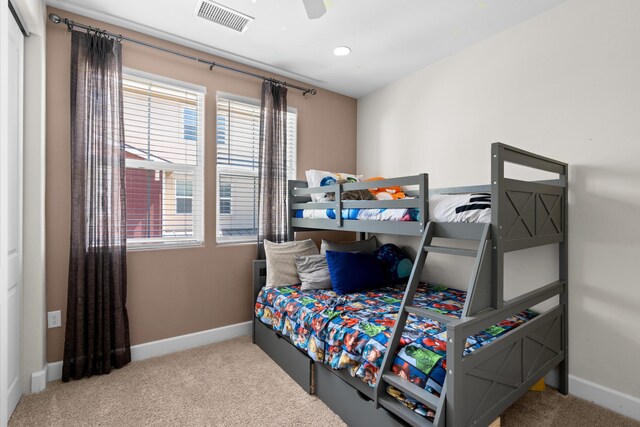 carpeted bedroom with ceiling fan