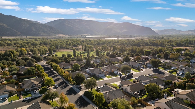 birds eye view of property with a mountain view and a residential view