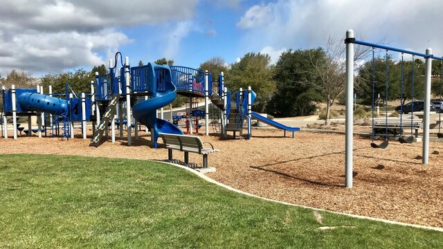 community playground featuring a yard