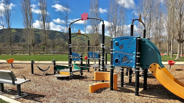 community jungle gym with a mountain view