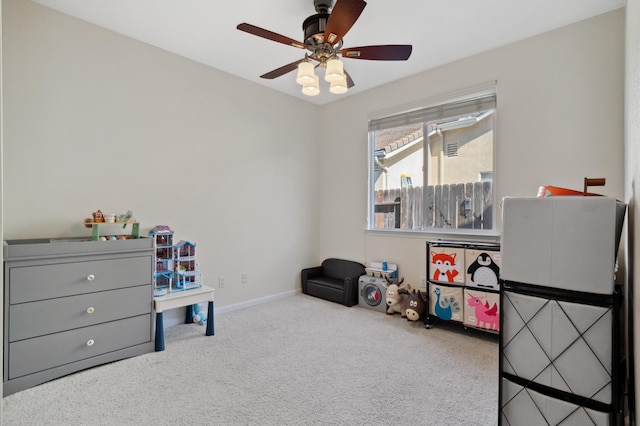 rec room with carpet flooring, baseboards, and ceiling fan