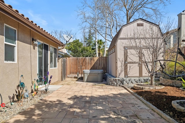 view of patio featuring an outbuilding and a fenced backyard