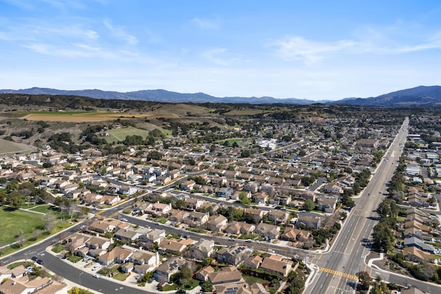 birds eye view of property with a mountain view and a residential view