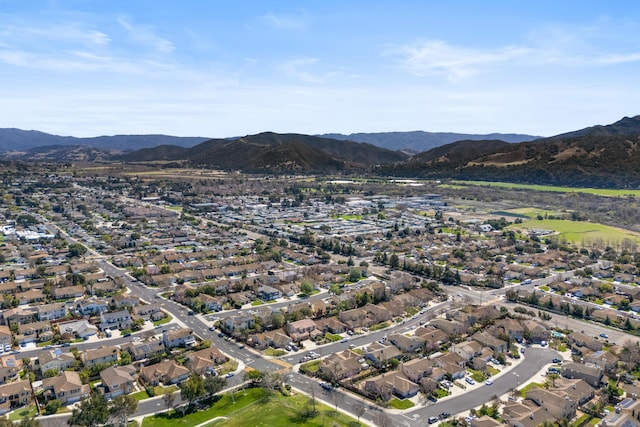 drone / aerial view featuring a residential view and a mountain view